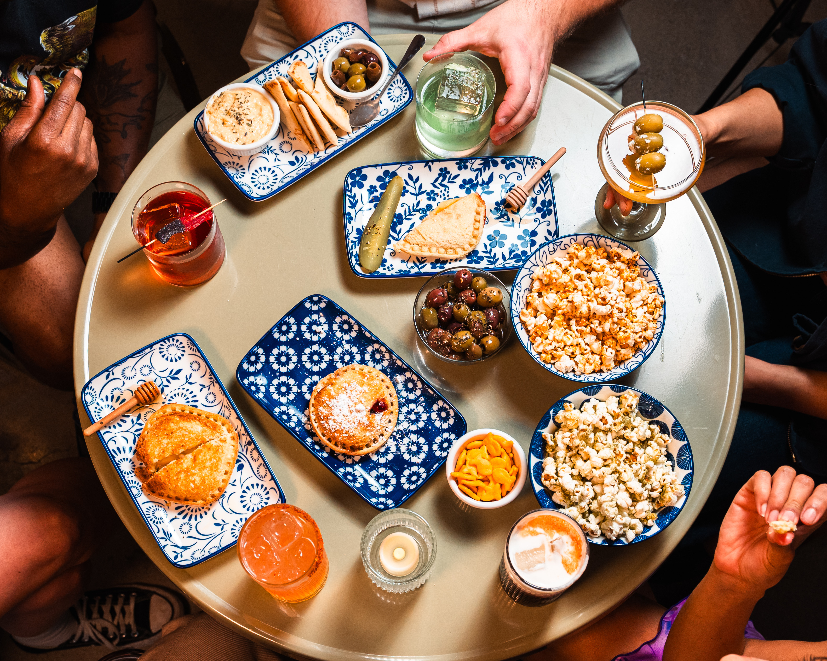 Overhead view of cocktails and small plates at Pals